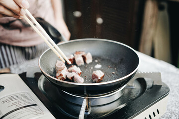 Homemade Fried Marinated juicy Grilled Kobe diced beef steak in a hot pan
