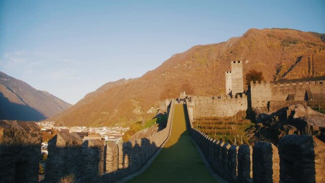 castle of bellinzona, ticino, switzerland at sunset with mountains, 4K