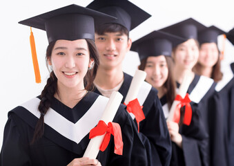Smiling asian girl student university graduate and classmates standing with diplomas in hands