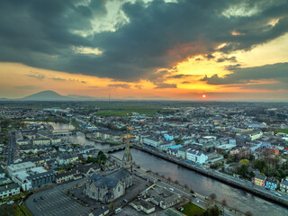 Fototapeta premium Ballina town during the sunset from above co Mayo Ireland Drone Footage 