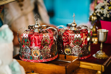 Fototapeta premium Wedding crowns. Wedding crown in church ready for marriage ceremony. close up. Divine Liturgy.