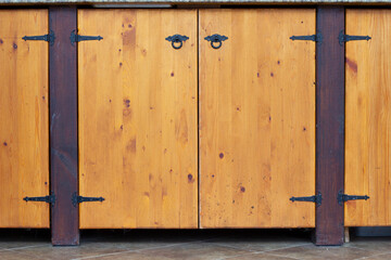 Patio kitchen design. Furniture facade. Wooden cabinet door in a simple style. Simple and comfortable furniture for the kitchen.