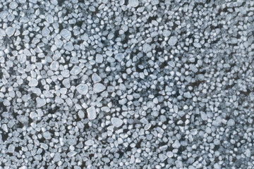 abstract texture of broken ice and dark blue water. background of the frozen surface of a clean lake or river