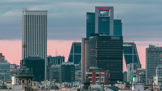 Madrid Skyline at sunset timelapse with some emblematic buildings such as Kio Towers