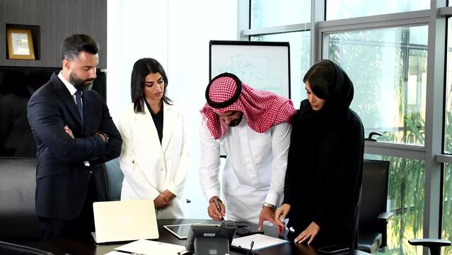 Multiethnic corporate business team meeting in the office for a strategic marketing plan - Office workers, entrepreneurs and company employee at work in a multinational company