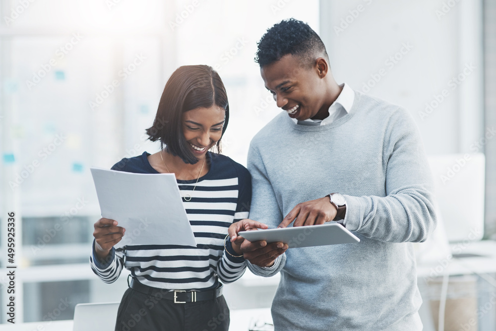 Aufkleber share your best ideas with the touch of a button. shot of two young businesspeople standing in their