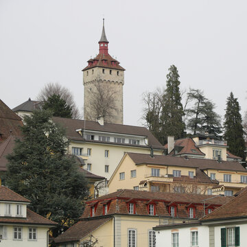 Roofs of houses in Lucerne and Wachtturm, historic tower.