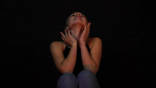 Happy and pleasant teenage girl sitting down