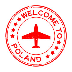 Grunge red welcome to Poland word with airplane icon round rubber seal stamp on white background