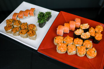 a set of sushi rolls from fish and seafood a set of different videos japanese cuisine delivery