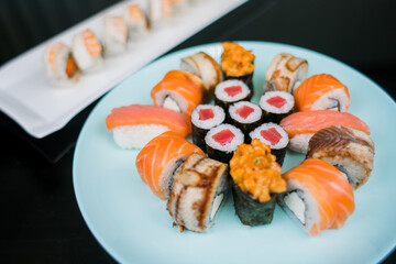 a set of sushi rolls from fish and seafood a set of different videos japanese cuisine delivery