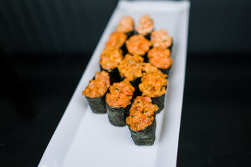 sushi rolls on a plate japanese cuisine delivery