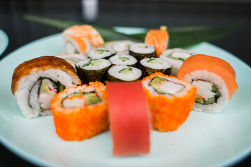 a set of sushi rolls from fish and seafood a set of different videos japanese cuisine delivery