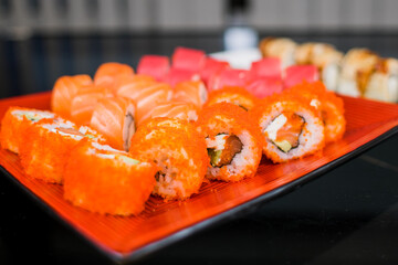 a set of sushi rolls from fish and seafood a set of different videos japanese cuisine delivery