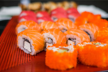 a set of sushi rolls from fish and seafood a set of different videos japanese cuisine delivery