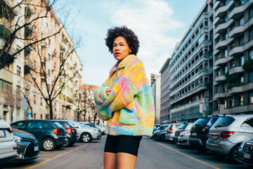 Young black woman outdoor looking over contemplative dancing