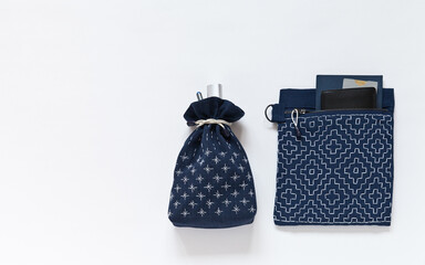 Two hand-sewing  blue fabric handbags with Sashiko embroidery: a pocket for documents and sack for...
