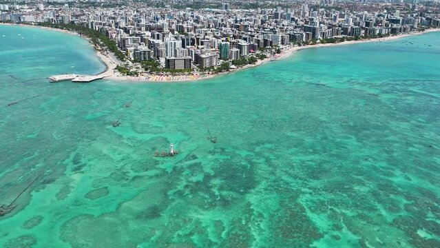 Maceio Alagoas Brazil at brazilian Northeast. Aerial panning shot of turquoise water beach at Maceio Alagoas Brazil. Landmark beach tourism sights. Travel destination