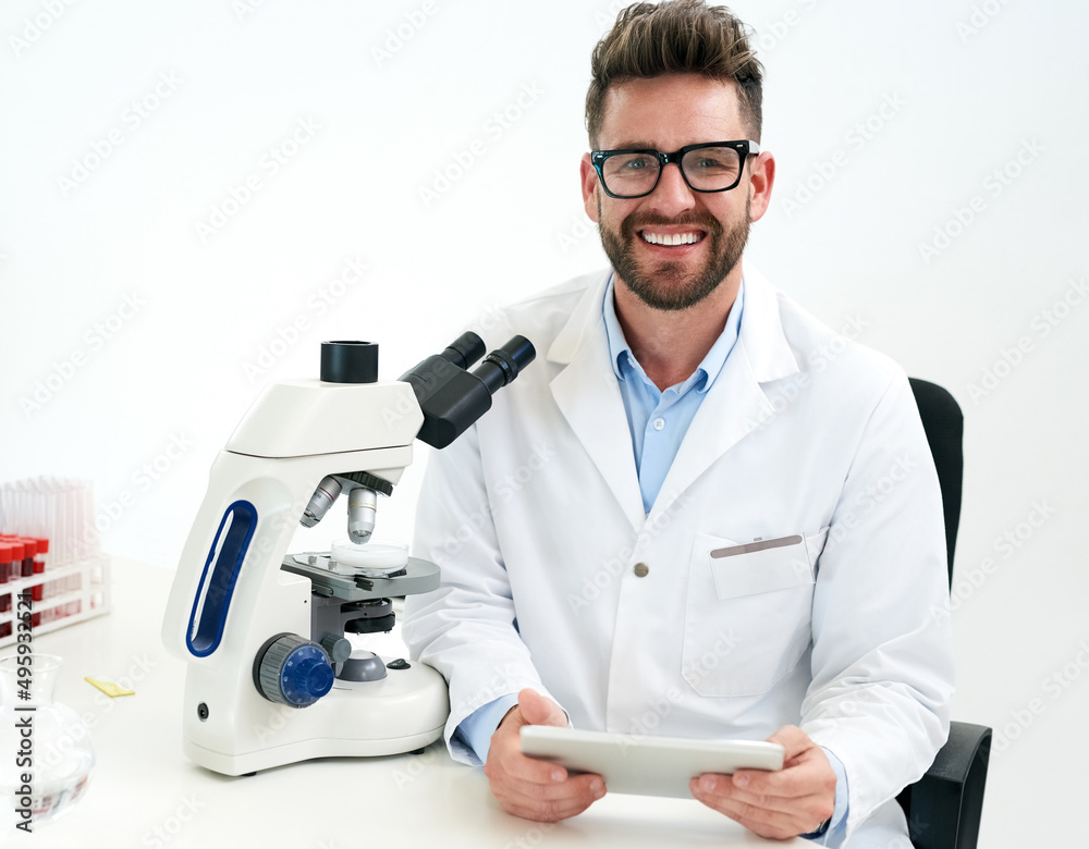 Poster advancing medical science and practice. portrait of a male scientist working in a lab.