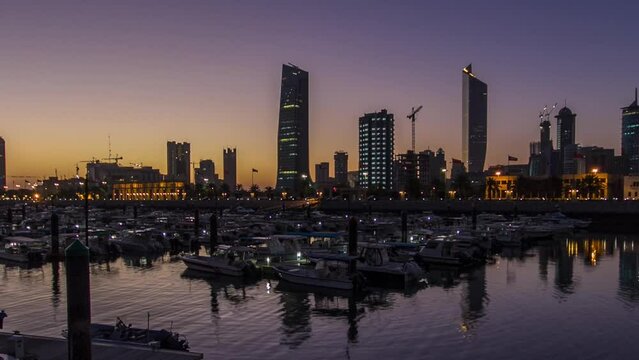 Yachts and boats at the Sharq Marina night to day timelapse in Kuwait. Kuwait City, Middle East
