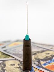 syringe needle from a cartridge and money