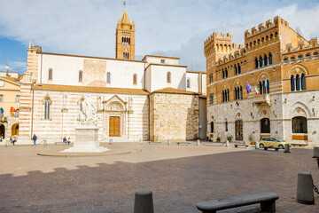 Fototapeta premium Morning view on Piazza Dante, central square in Grosseto town on sunny day. This city is the center of Maremma region at western central Italy