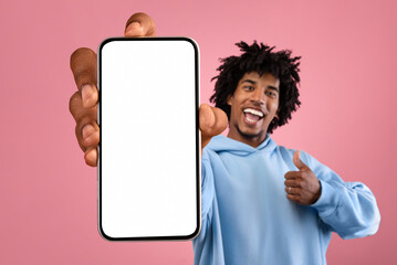 Cheerful Black Hipster Guy Holding Big Blank Mobile Phone And Showing Thumb Up
