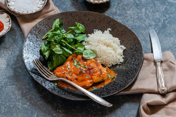 Creamy paprika chicken with rice and lamb's lettuce