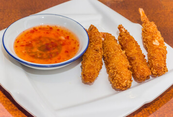 Traditional crispy breaded chinese shrimp served with spicy sauce