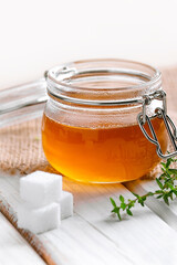 homemade thyme cough syrup in a jar