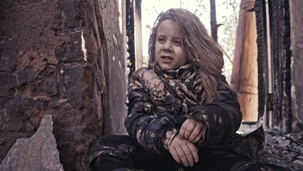 Fototapeta na wymiar girl praying. Children without a home, apocalypse, war