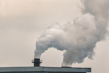 Emission smoke pollution to the air from industrial plant chimney