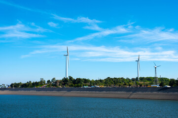 Beautiful landscape of Khao Yai Thiang reservoir with wind turbine electrical energy plant at Nakhon Ratchasima, Thailand.