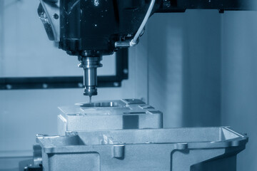 The vertical machining center cutting the aluminum gear housing parts by solid flat end mill tool.