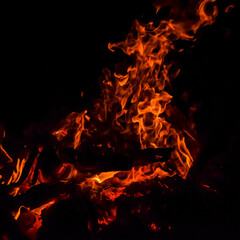 Fire flames on black background, Blaze fire flame texture background, Beautifully, the fire is burning, Fire flames with wood and cow dung