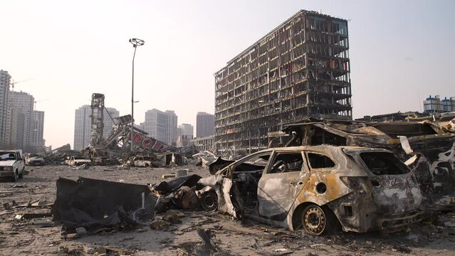 Russia war damage building destruction city war ruins city damage car. Terror attack bomb shell of civilian bombed. Disaster area. 2022 Russian invasion of Ukraine war torn city destroyed car burn out