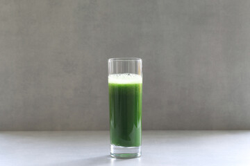 Green vegetable juice for a raw vegan diet. Fresh green from herbs and cabbage. Aojiru is a Japanese drink. Aojiru is a Japanese vegetable drink made from kale cabbage.