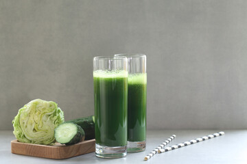 Green vegetable juice for a raw vegan diet. Fresh green from herbs and cabbage. Aojiru is a...