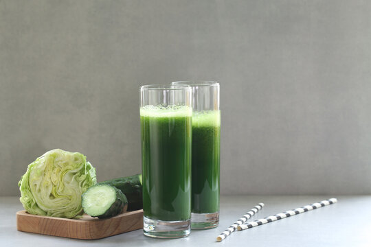 Green vegetable juice for a raw vegan diet. Fresh green from herbs and cabbage. Aojiru is a Japanese drink. Aojiru is a Japanese vegetable drink made from kale cabbage.