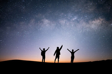 Silhouette group of young traveler and backpacker watched the star and milky way on top of the...