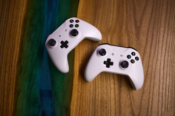 Two white game joysticks on the table © wipeout86