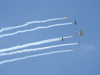 World War II aircraft performing at an airshow in the skies of southern California.