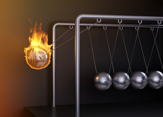 Newton's pendulum with one burning ball
