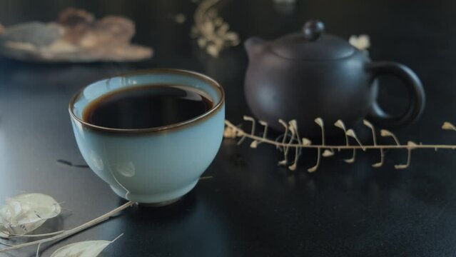 Black tea. Chinese tea ceremony. Ceramic kettle. Close-up. Aesthetic video