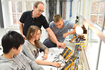 technical vocational training in industry: young apprentices and trainers in the classroom - obrazy, fototapety, plakaty
