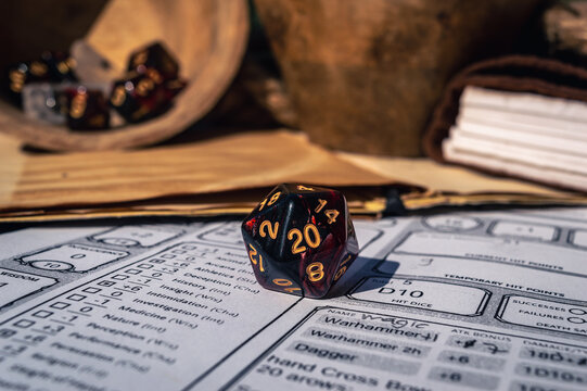 Close-up image of a d20 on a character sheet