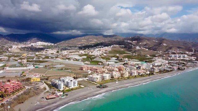 Torrox Costa view from above. Drone footage of this costal city situated in Malaga province, Costa del Sol - Spain. Touristic travel destination. Right panning