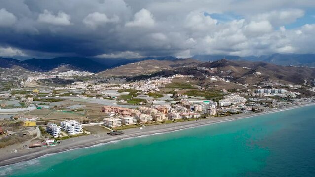 Torrox Costa view from above. Drone footage of this costal city situated in Malaga province, Costa del Sol - Spain. Touristic travel destination. Drone forward