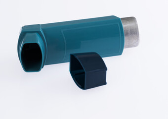 Close up of asthma inhaler on white background