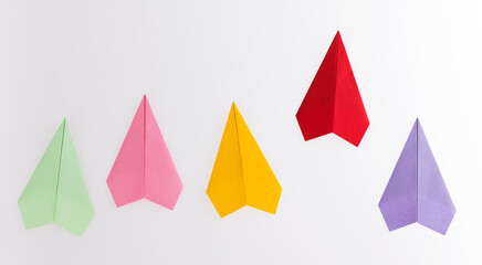 The red origami plane is leader